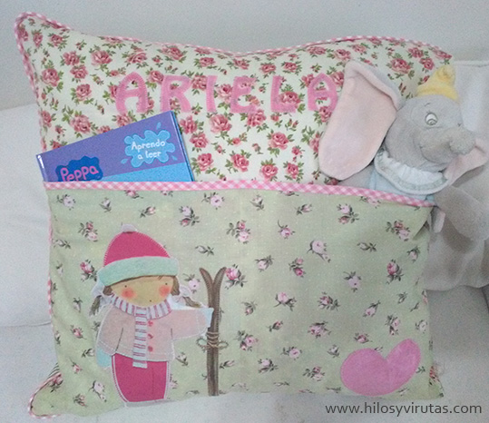 cojin con bolsillos esquiadora rosa