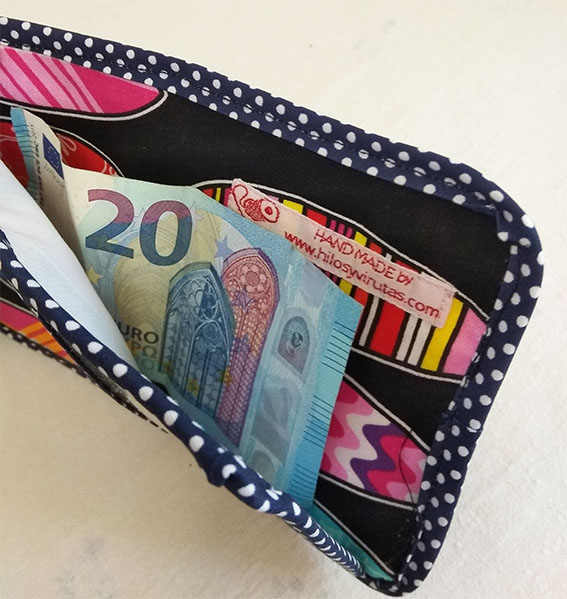 billetera retales con billete surf